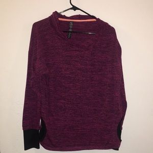 Sweater with thumb holes and pockets